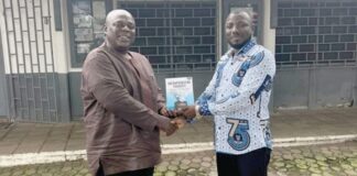 Samuel Koku Anyidoho (left), Founder and President of the Atta Mills Institute, presenting a copy of the book to Professor Alidu Seidu, Head of the Political Science Department, University of Ghana