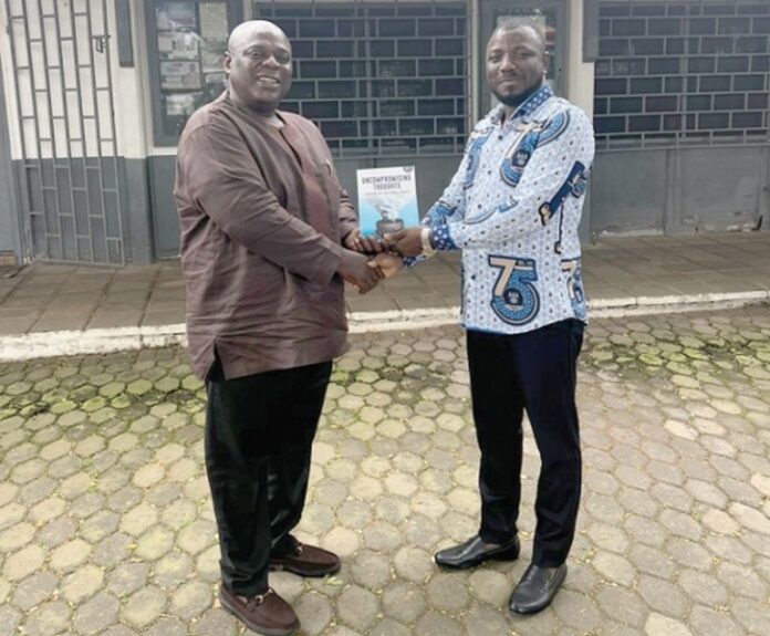 Samuel Koku Anyidoho (left), Founder and President of the Atta Mills Institute, presenting a copy of the book to Professor Alidu Seidu, Head of the Political Science Department, University of Ghana