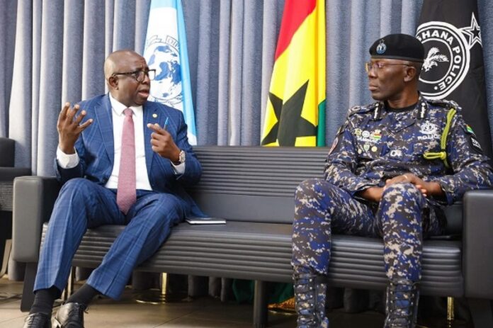 Inspector-General of Police Dr. George Akuffo Dampare (right) having an interaction with Assistant Inspector-General of Police (Rtd) Garba Baba Umar