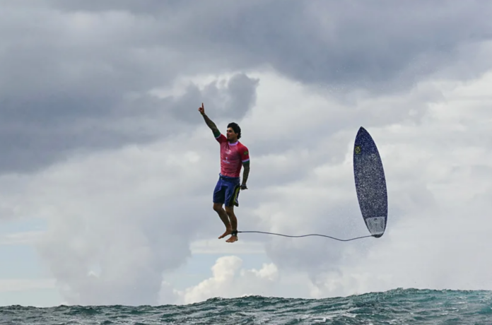 Brazil's Gabriel Medina reacts after getting a large wave in the 5th heat of the men's surfing round three in Teahupo'o during the Paris 2024 Olympic Games (Credit: Getty Images)