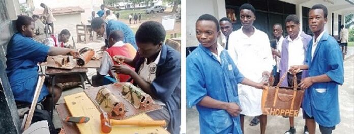 Some of the candidates undertaking their leatherwork practicals at Accra High School