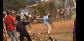 Some members of NPP and NDC pelting stones at each other