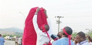 Members of the VRA Senior Staff Association pulled red cloths on symbolic items on the company’s premises