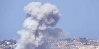 Smoke from Israeli airstrikes on villages in the Nabatiyeh district is visible Monday from the southern town of Marjayoun, Lebanon. (Hussein Malla / Associated Press)