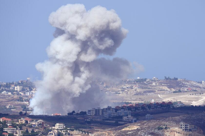 Smoke from Israeli airstrikes on villages in the Nabatiyeh district is visible Monday from the southern town of Marjayoun, Lebanon. (Hussein Malla / Associated Press)