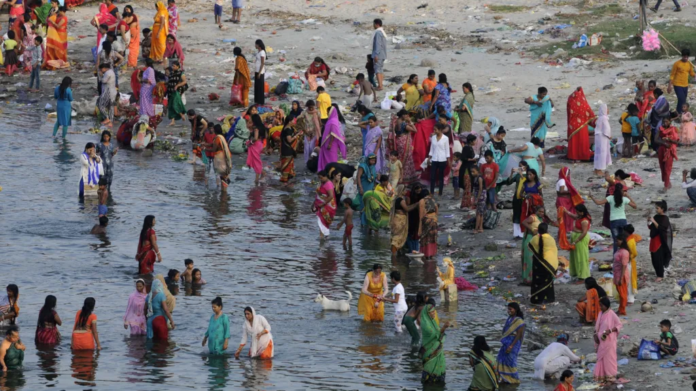 Hindustan Times via Getty Images The annual Jivitputrika festival is celebrated in several states in north-eastern India. In this 2020 photo, women and children are seen bathing in a river in the Uttar Pradesh state.