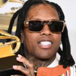 Getty Images | Lil Durk holding the Grammy Award he won for best melodic rap performance in February