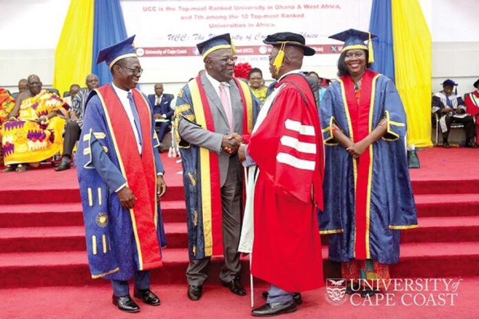 Sir Sam Jonah (2nd from left), Chancellor of UCC, congratulating Dr Ben Bishop Nyanihorba Ayamba. Looking on are Prof. Johnson Nyarko Boampong (left), Vice-Chancellor, and Prof. Rosemond Boohene, Pro Vice-Chancellor of UCC