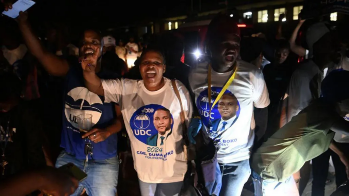 AFP | UDC supporters were celebrating as the results came in overnight