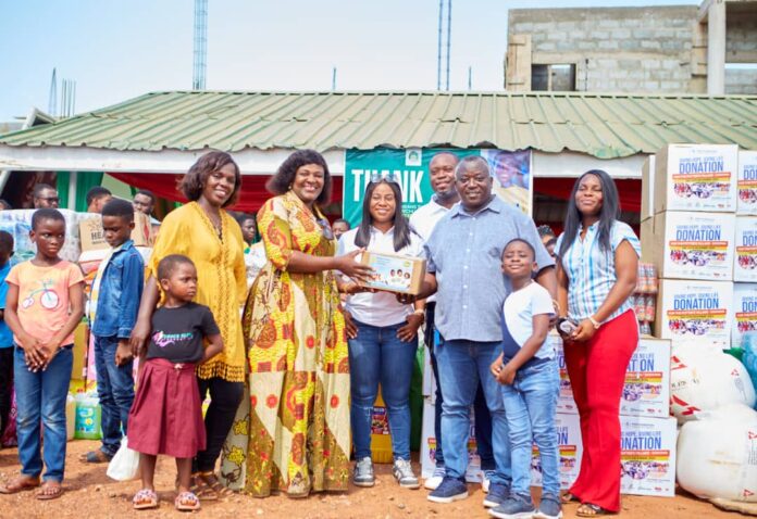 Mr Michael Abbiw presenting the items to Madam Owusu, CEO of Potter's Village