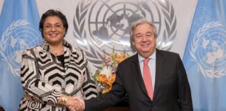 Secretary-General António Guterres (right) swears in Hannah S. Tetteh, Director-General of the United Nations Office at Nairobi.