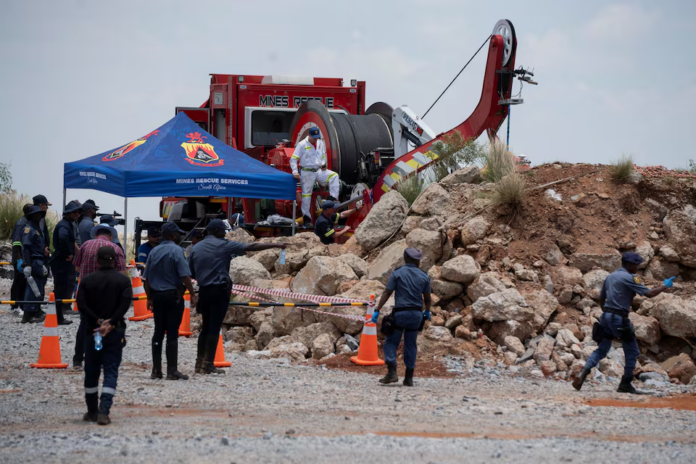 Members of the South African police, patrol as they guard the mine shaft where rescue operations are ongoing as attempts are made to rescue illegal miners who have been underground for months in Stilfontein, South Africa, January 14, 2025. REUTERS/Ihsaan Haffejee